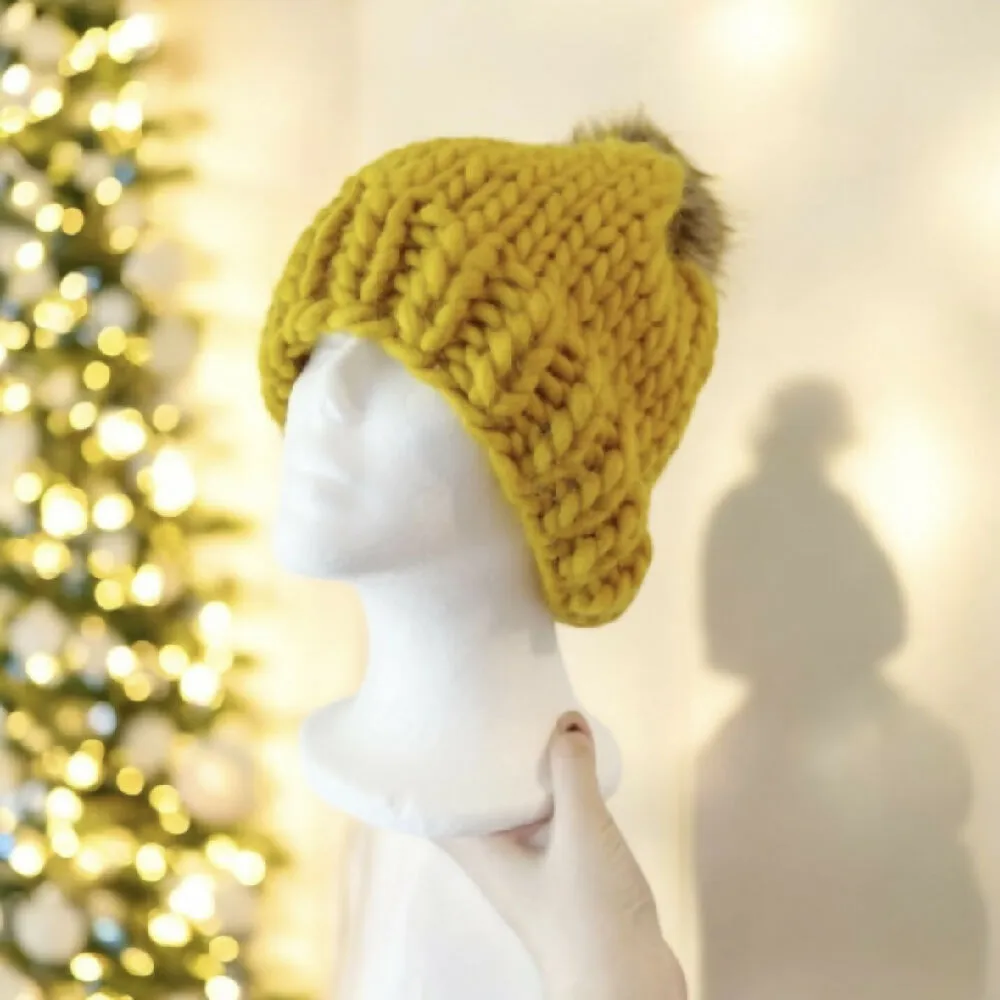 Super chunky hand knit merino wool mustard yellow beanie with faux fur pompom