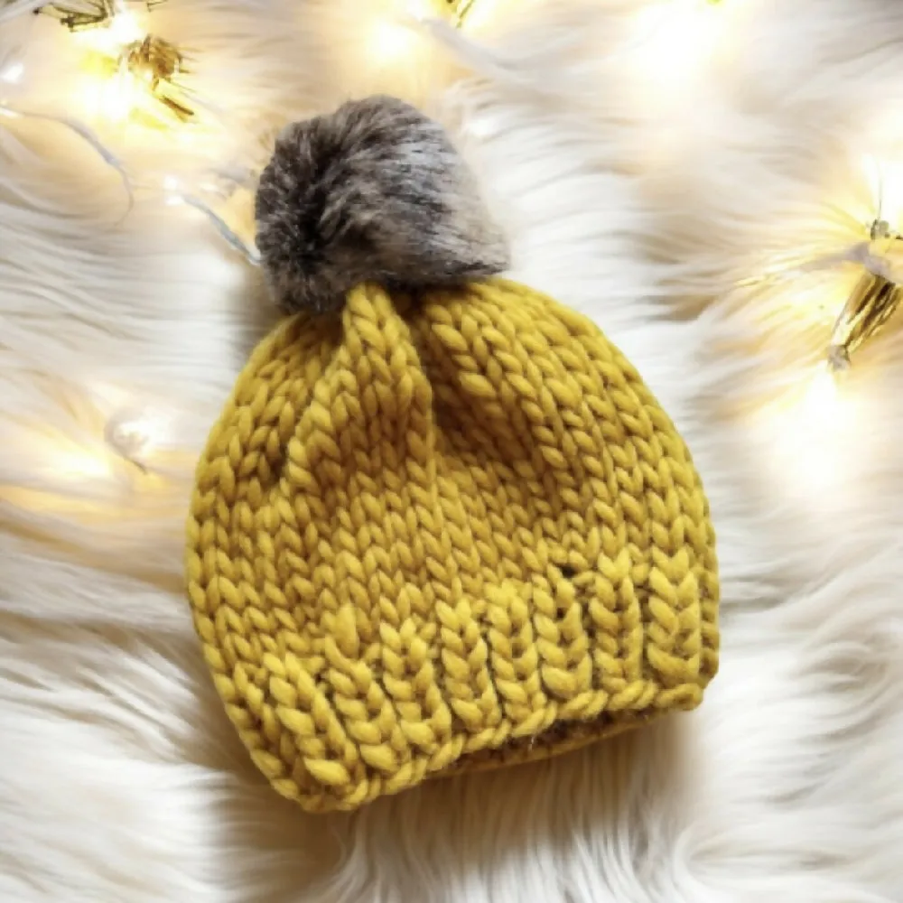 Super chunky hand knit merino wool mustard yellow beanie with faux fur pompom