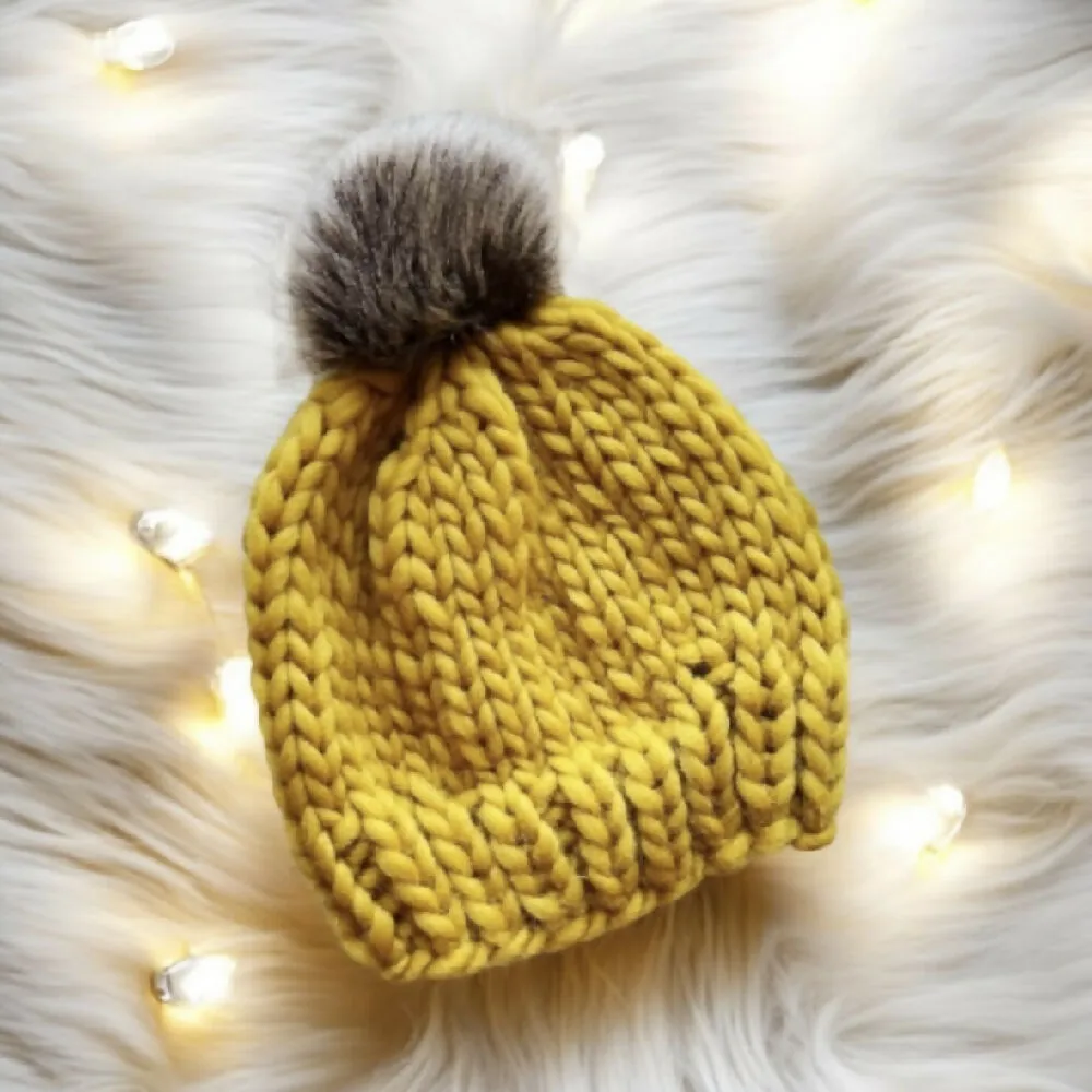 Super chunky hand knit merino wool mustard yellow beanie with faux fur pompom